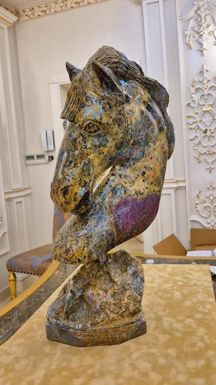 Ochre horse in emerald matrix